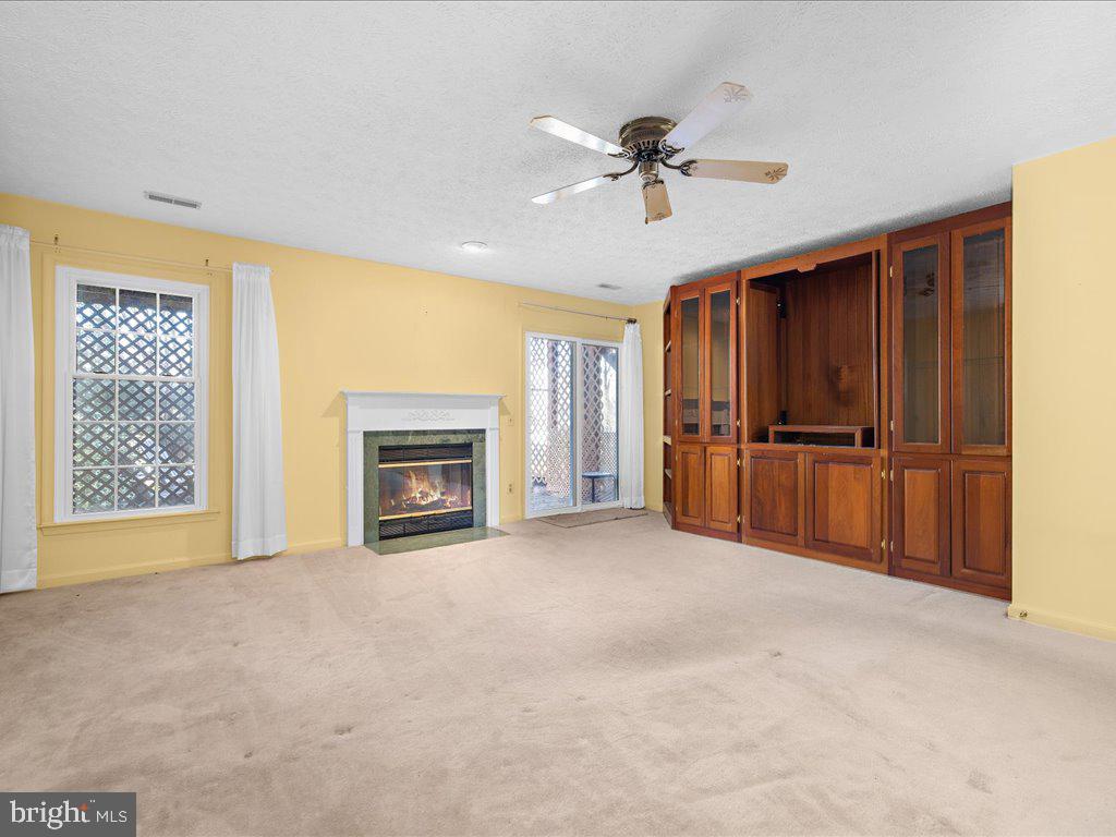 266 St Michaels Circle Odenton, MD 21113 - Photo 7 of 42 a view of an empty room with a fireplace