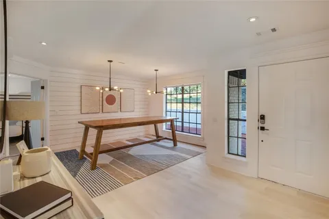 a living room with a couch and two windows