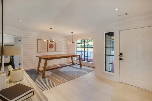 a living room with a couch and two windows