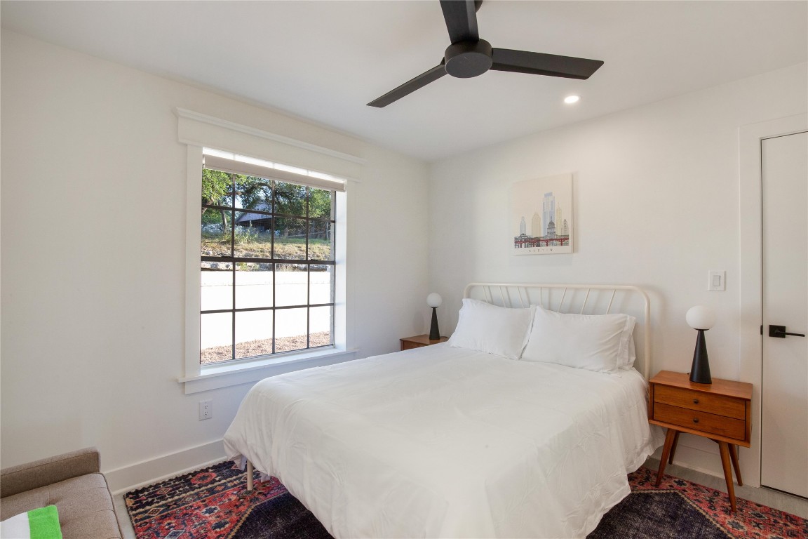 171 Hart Lane Dripping Springs, TX 78620 - Photo 20 of 40 a bedroom with a bed and a window