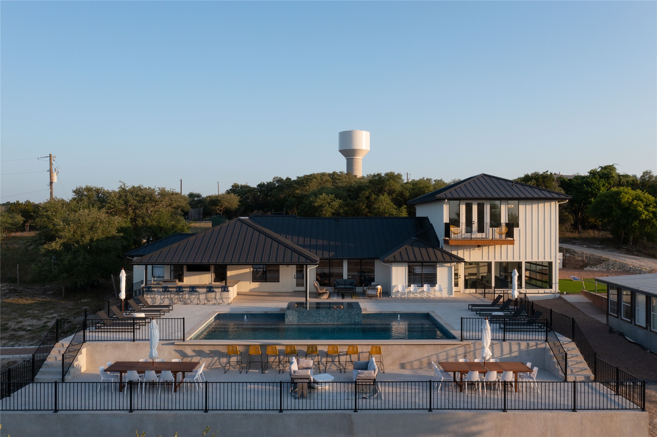 171 Hart Lane Dripping Springs, TX 78620 - Photo 2 of 40 an aerial view of a house with swimming pool