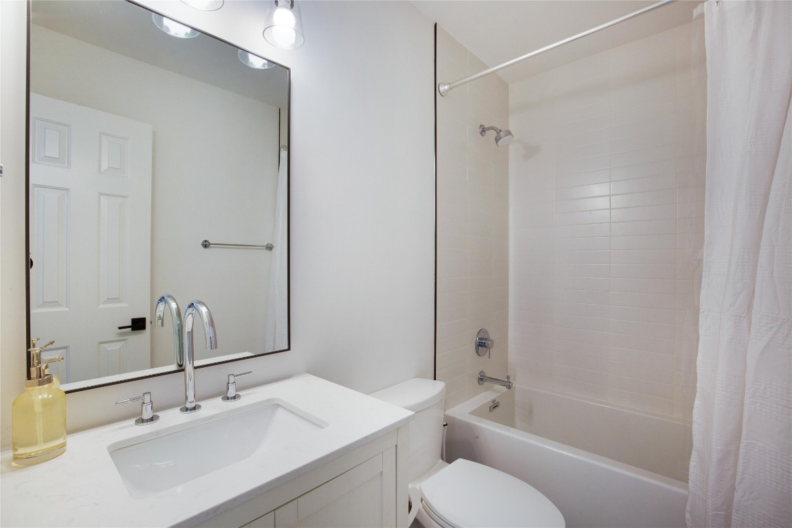 171 Hart Lane Dripping Springs, TX 78620 - Photo 24 of 40 a bathroom with a sink toilet and shower