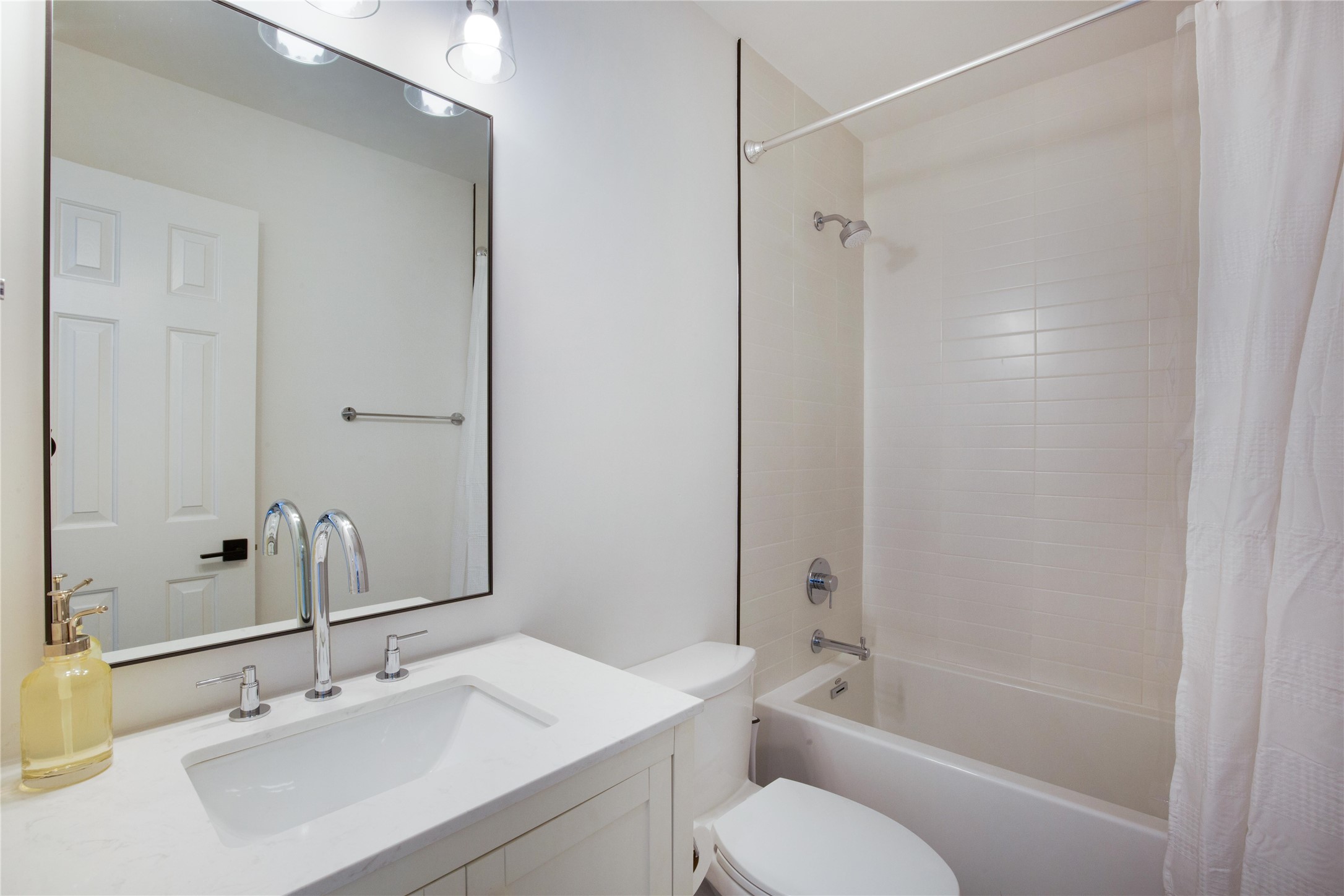 171 Hart Lane Dripping Springs, TX 78620 - Photo 24 of 40 a bathroom with a sink toilet and shower