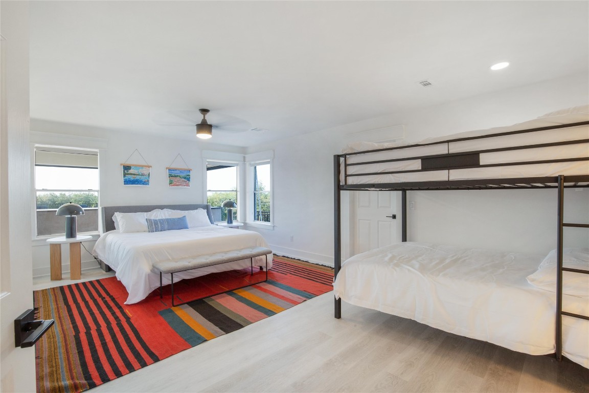 171 Hart Lane Dripping Springs, TX 78620 - Photo 25 of 40 a bedroom with a bed and window