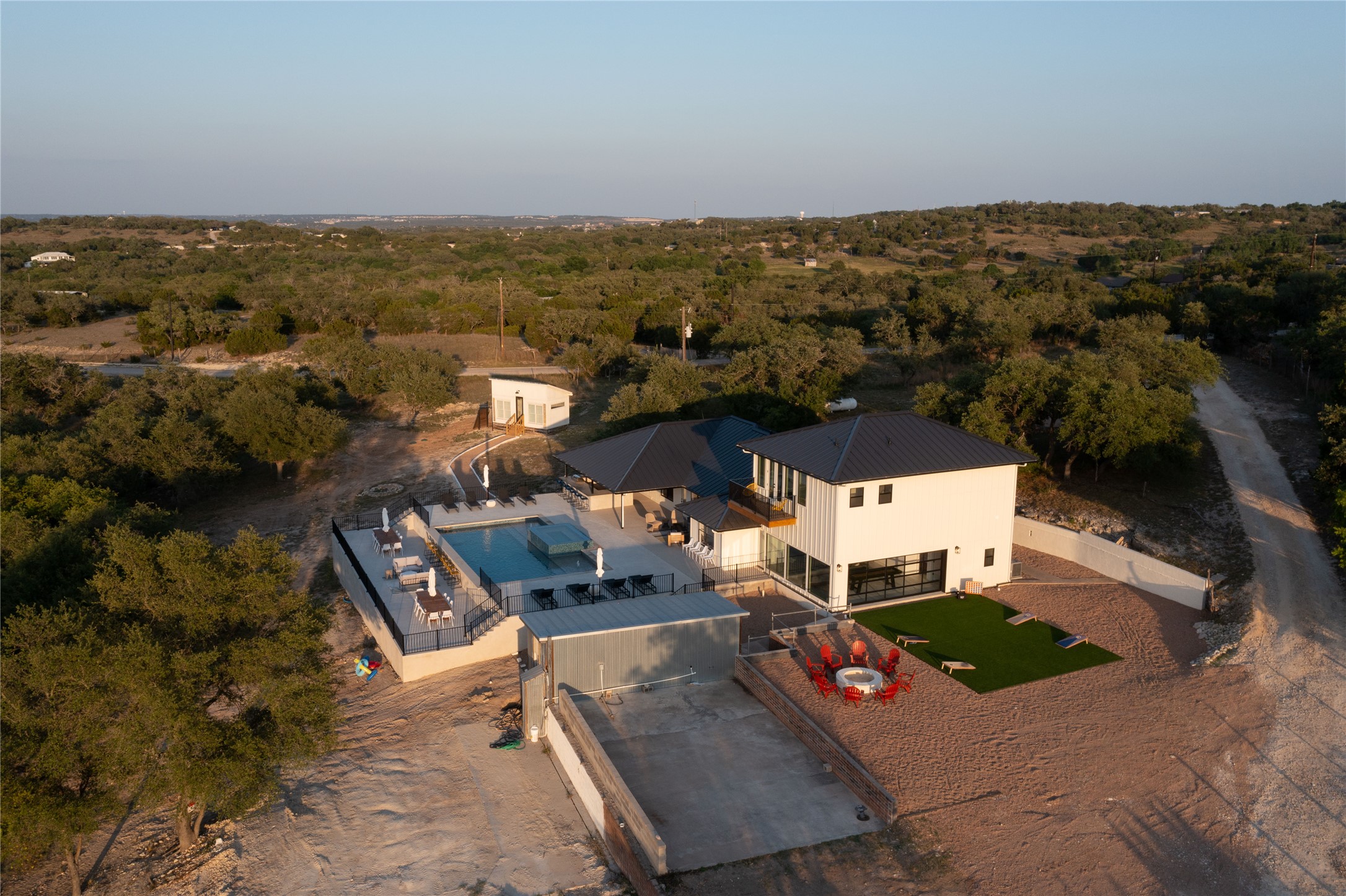 171 Hart Lane Dripping Springs, TX 78620 - Photo 3 of 40 an aerial view of a house with a yard