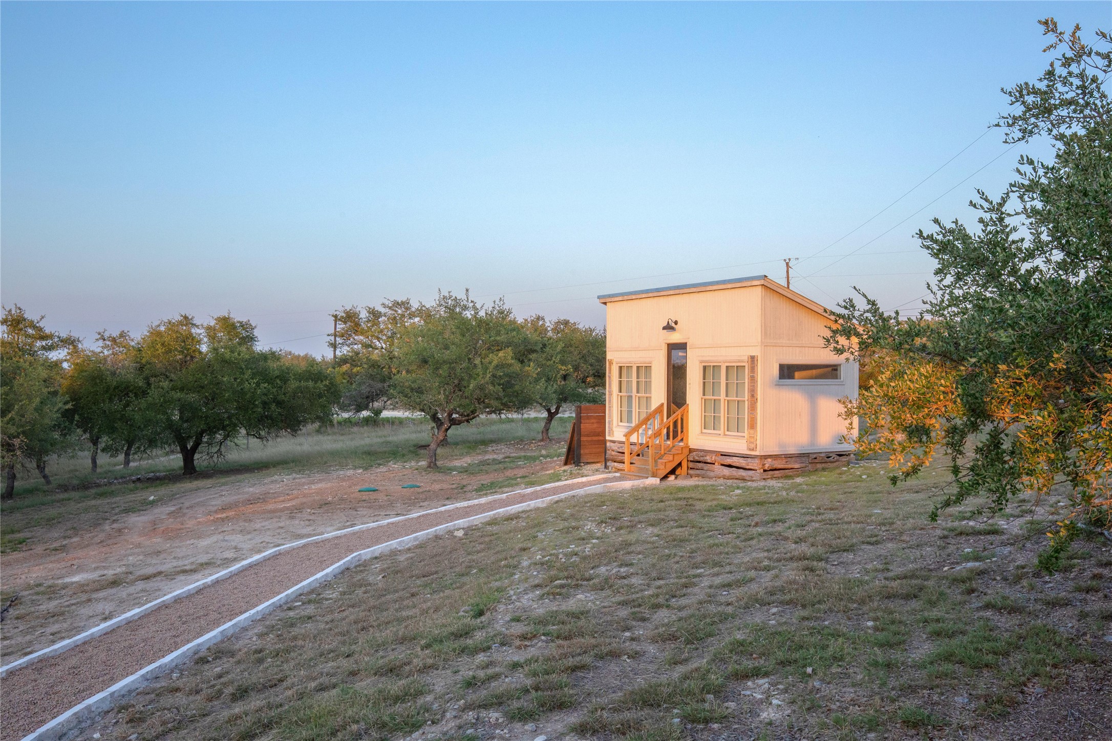 171 Hart Lane Dripping Springs, TX 78620 - Photo 36 of 40 a view of a house with a yard