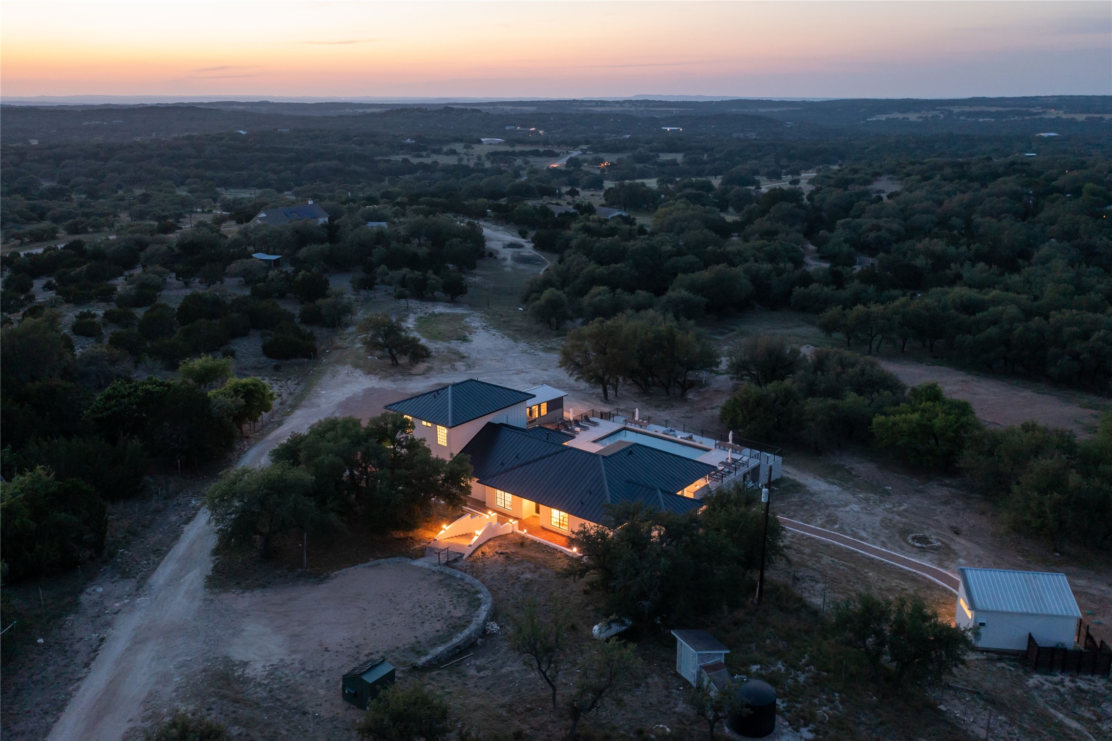 171 Hart Lane Dripping Springs, TX 78620 - Photo 6 of 40 an aerial view of house with yard and mountain view in back
