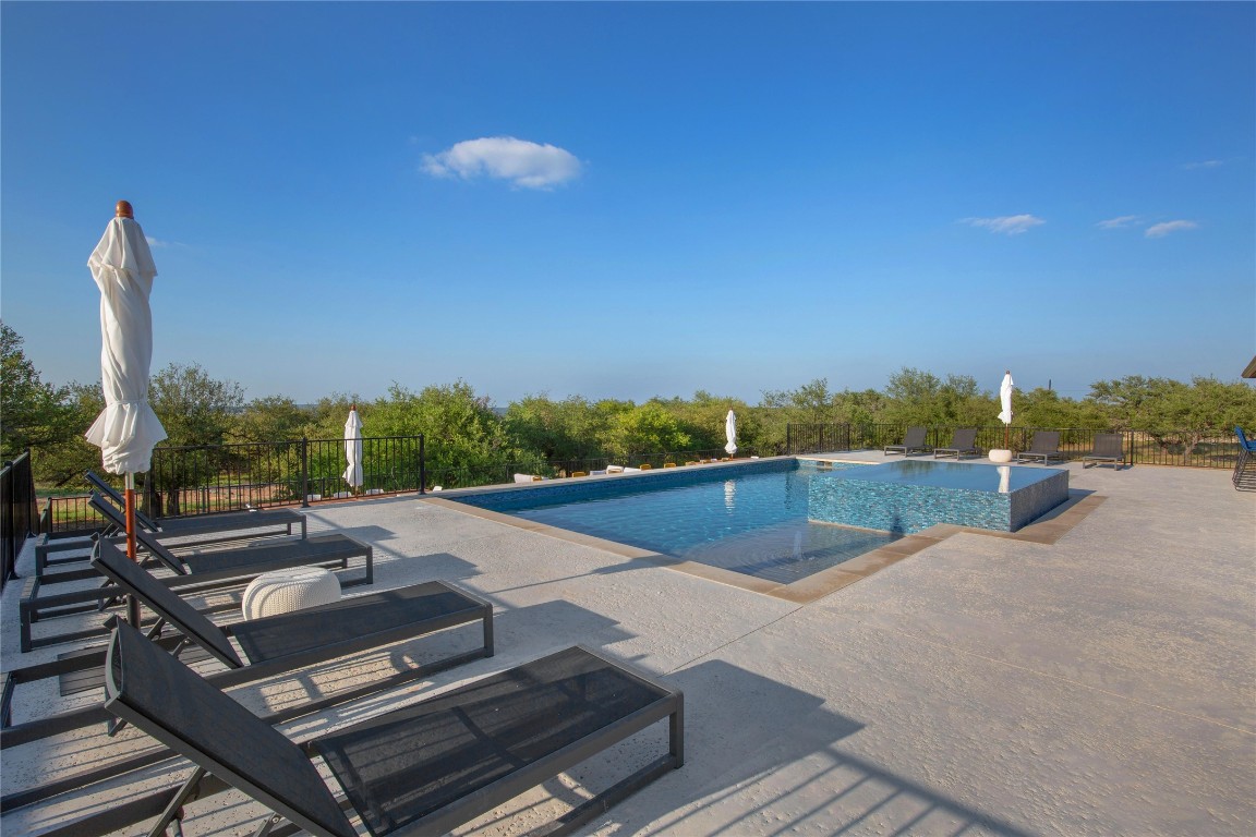 171 Hart Lane Dripping Springs, TX 78620 - Photo 9 of 40 a view of a patio with swimming pool
