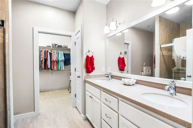 a bathroom with a sink vanity and mirror