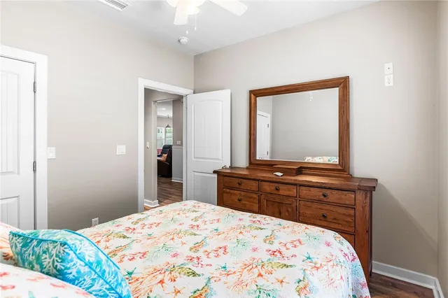 a bedroom with a bed and a dresser