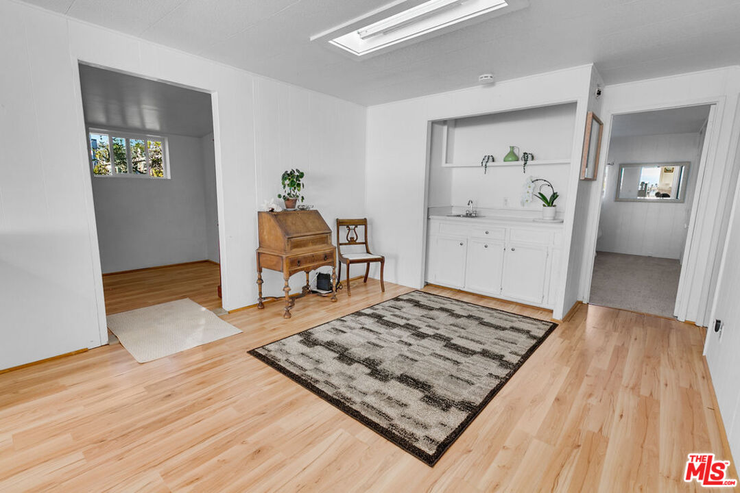 29500 Heathercliff Road, Unit 252 Malibu, CA 90265 - Photo 20 of 50 a living room with a rug