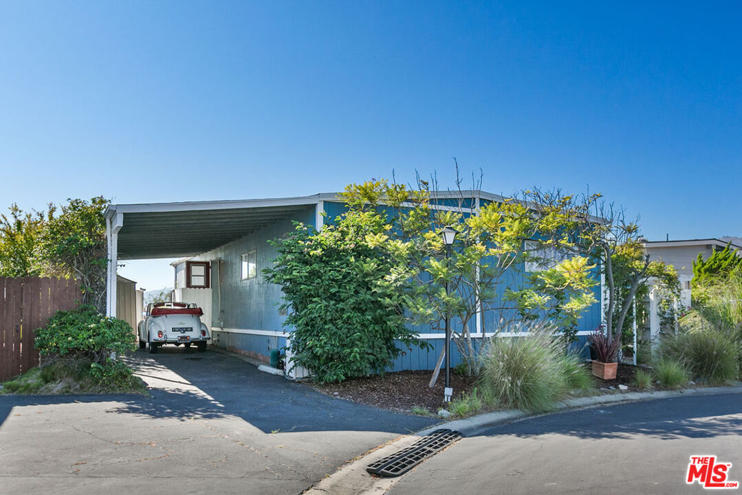 29500 Heathercliff Road, Unit 252 Malibu, CA 90265 - Photo 2 of 50 a front view of a house with a yard