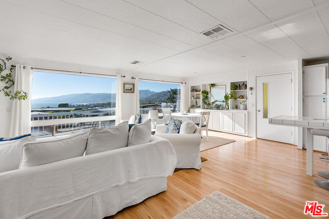 29500 Heathercliff Road, Unit 252 Malibu, CA 90265 - Photo 10 of 50 a living room with furniture and a large window
