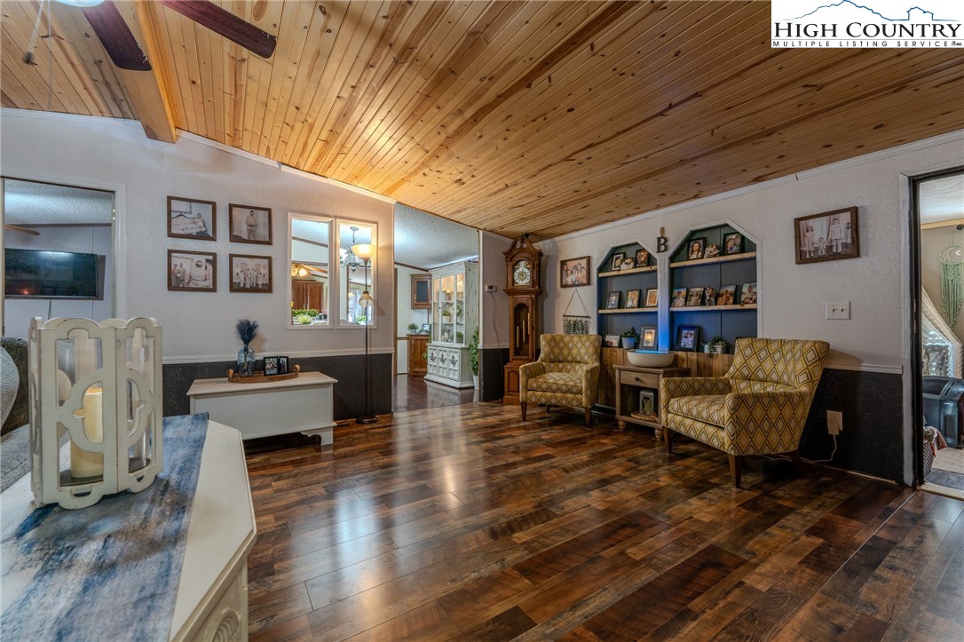 672 Upper Hanging Rock Road Spruce Pine, NC 28777 - Photo 6 of 22 a living room with furniture and a flat screen tv