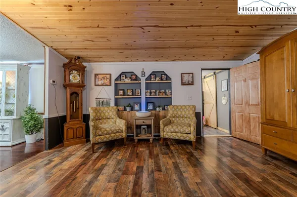 a spacious bedroom with a bed and a couch