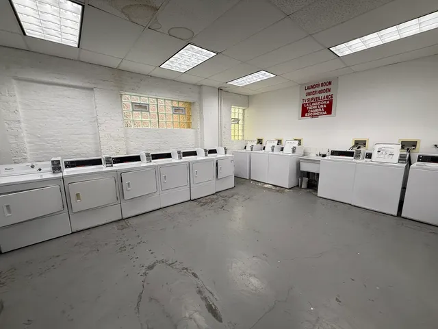 a large white room with cabinets