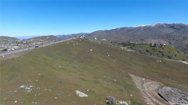 a view of a mountain with a mountain in the background