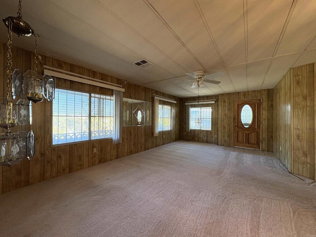 7467 Mission Gorge Road, Unit 293 Santee, CA 92071 - Photo 11 of 49 a view of a livingroom with a fireplace and window
