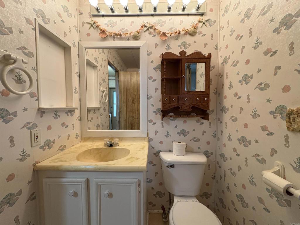 7467 Mission Gorge Road, Unit 293 Santee, CA 92071 - Photo 16 of 49 a bathroom with a sink and a toilet