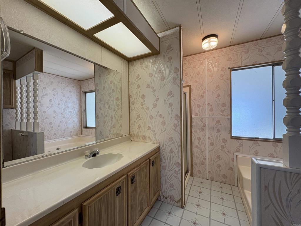 7467 Mission Gorge Road, Unit 293 Santee, CA 92071 - Photo 25 of 49 a bathroom with a sink and a mirror
