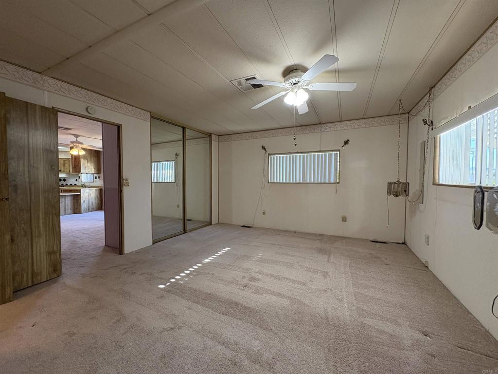 7467 Mission Gorge Road, Unit 293 Santee, CA 92071 - Photo 28 of 49 an empty room with closet and windows