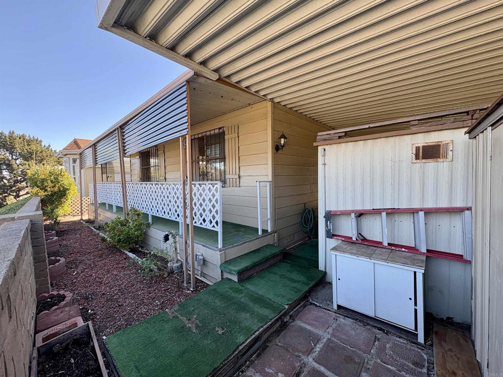 7467 Mission Gorge Road, Unit 293 Santee, CA 92071 - Photo 38 of 49 a front view of a house with garden