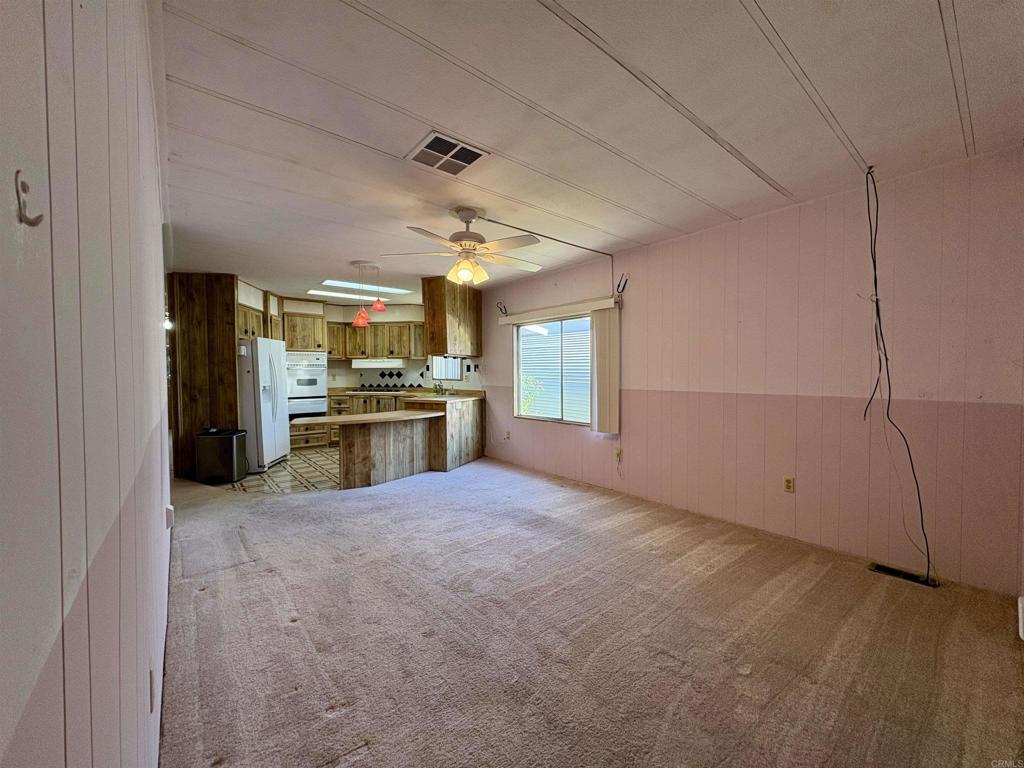 7467 Mission Gorge Road, Unit 293 Santee, CA 92071 - Photo 6 of 49 a view of an empty room with a kitchen