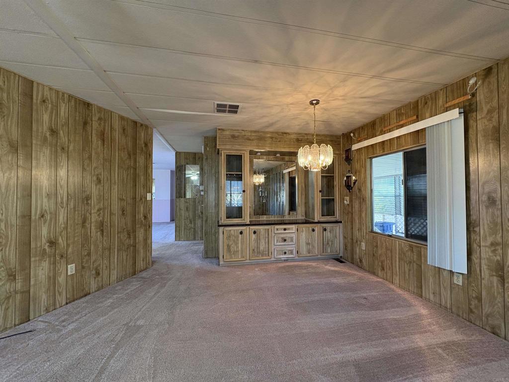 7467 Mission Gorge Road, Unit 293 Santee, CA 92071 - Photo 8 of 49 a view of a hallway with wooden shelves