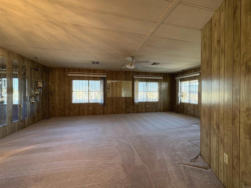 7467 Mission Gorge Road, Unit 293 Santee, CA 92071 - Photo 10 of 49 a view of an empty room with windows