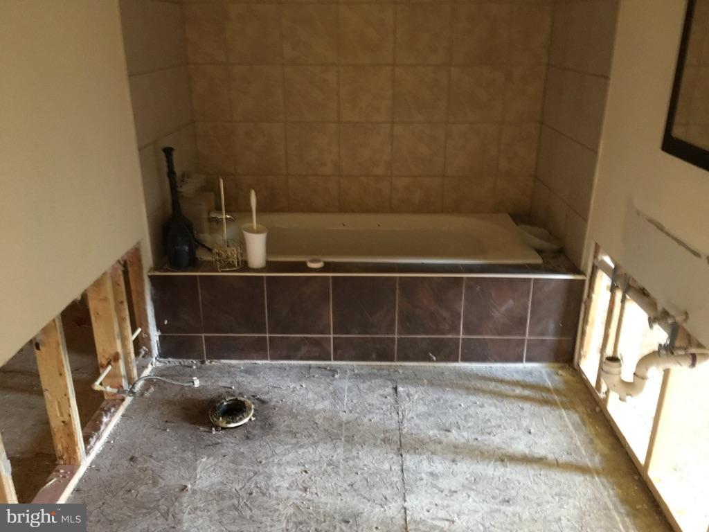 5950 Hallowing Point Road Prince Frederick, MD 20678 - Photo 8 of 9 Tiled bath- damaged walls & flooring removed