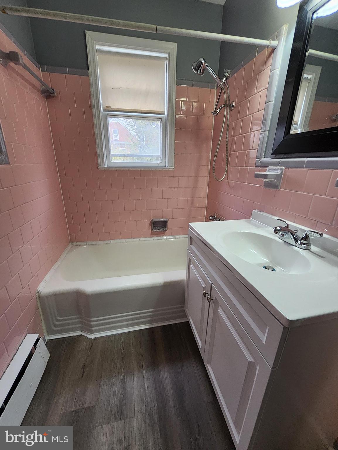 13723 Dumfries Road Manassas, VA 20112 - Photo 14 of 21 a bathroom with a tub sink and mirror