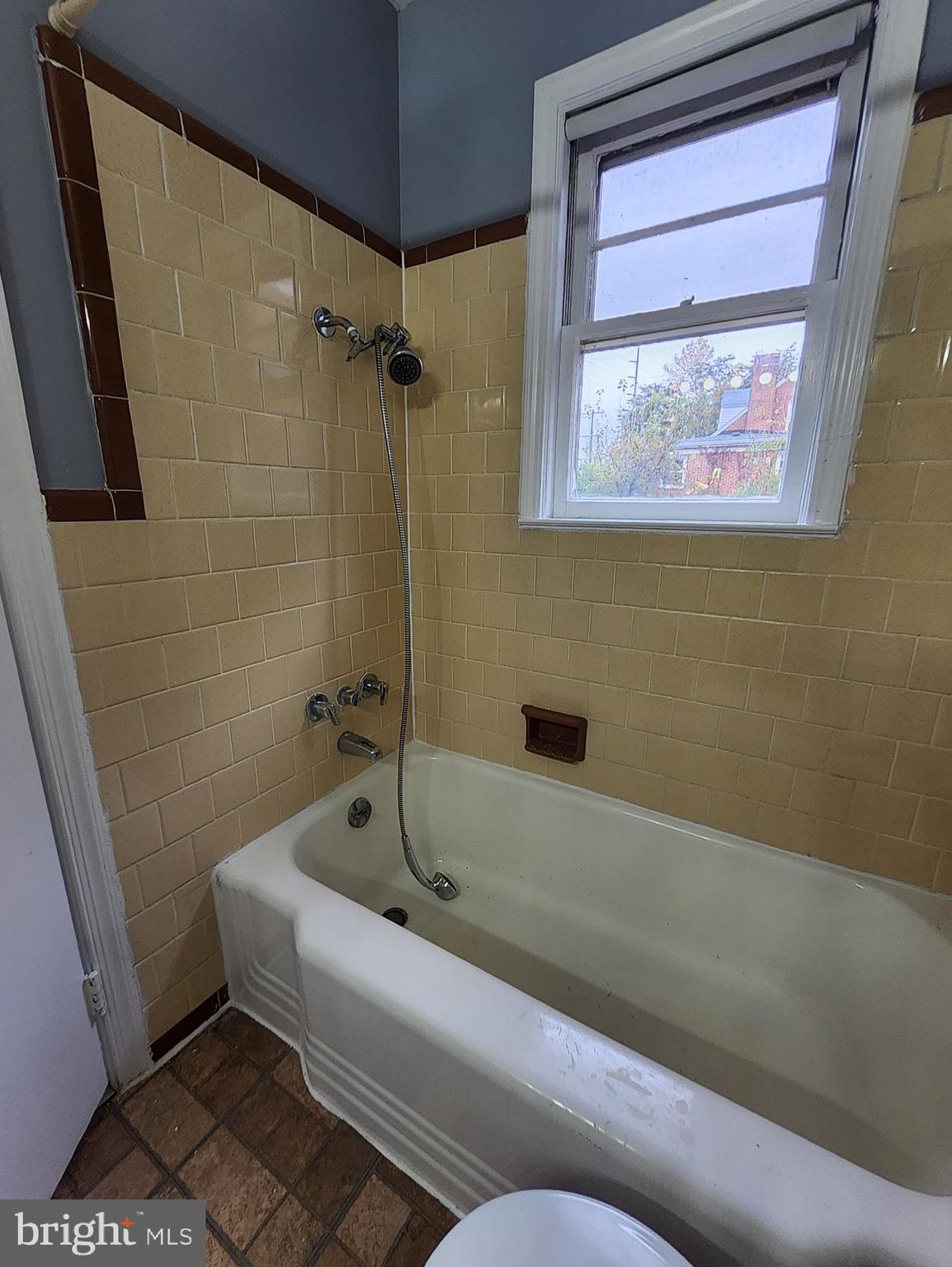 13723 Dumfries Road Manassas, VA 20112 - Photo 17 of 21 a bathroom with a bathtub and a shower