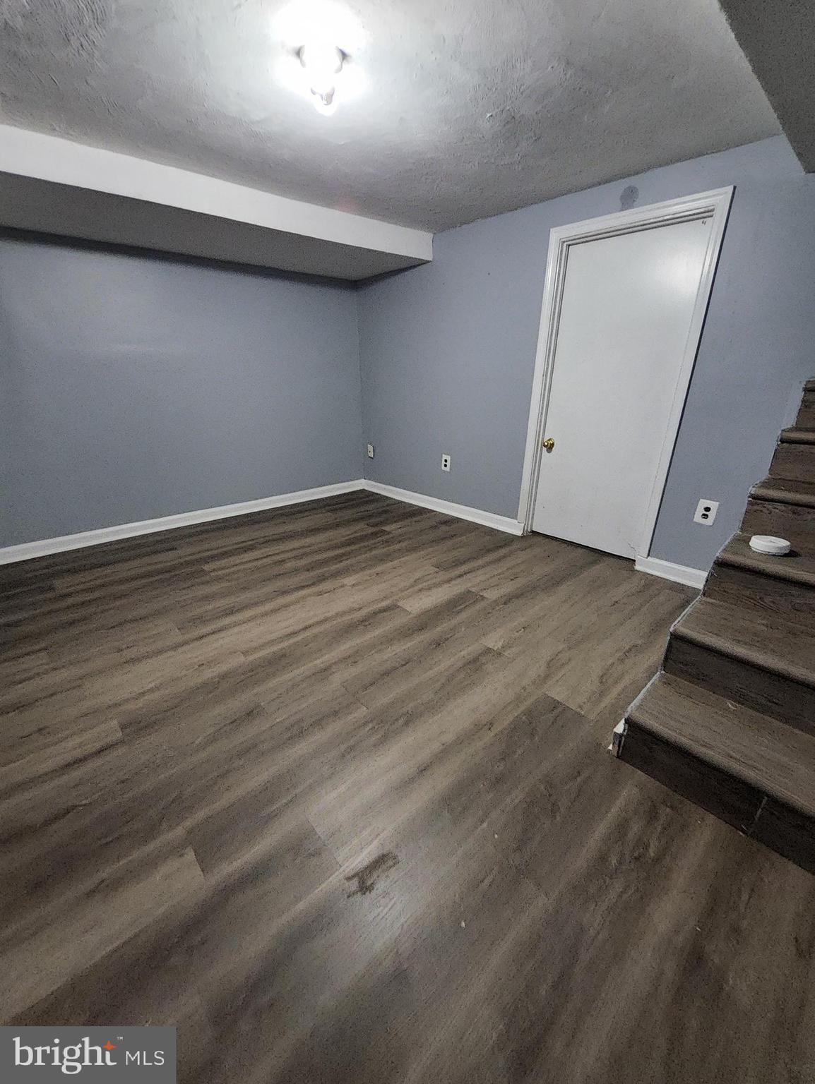 13723 Dumfries Road Manassas, VA 20112 - Photo 18 of 21 a view of an empty room with wooden floor