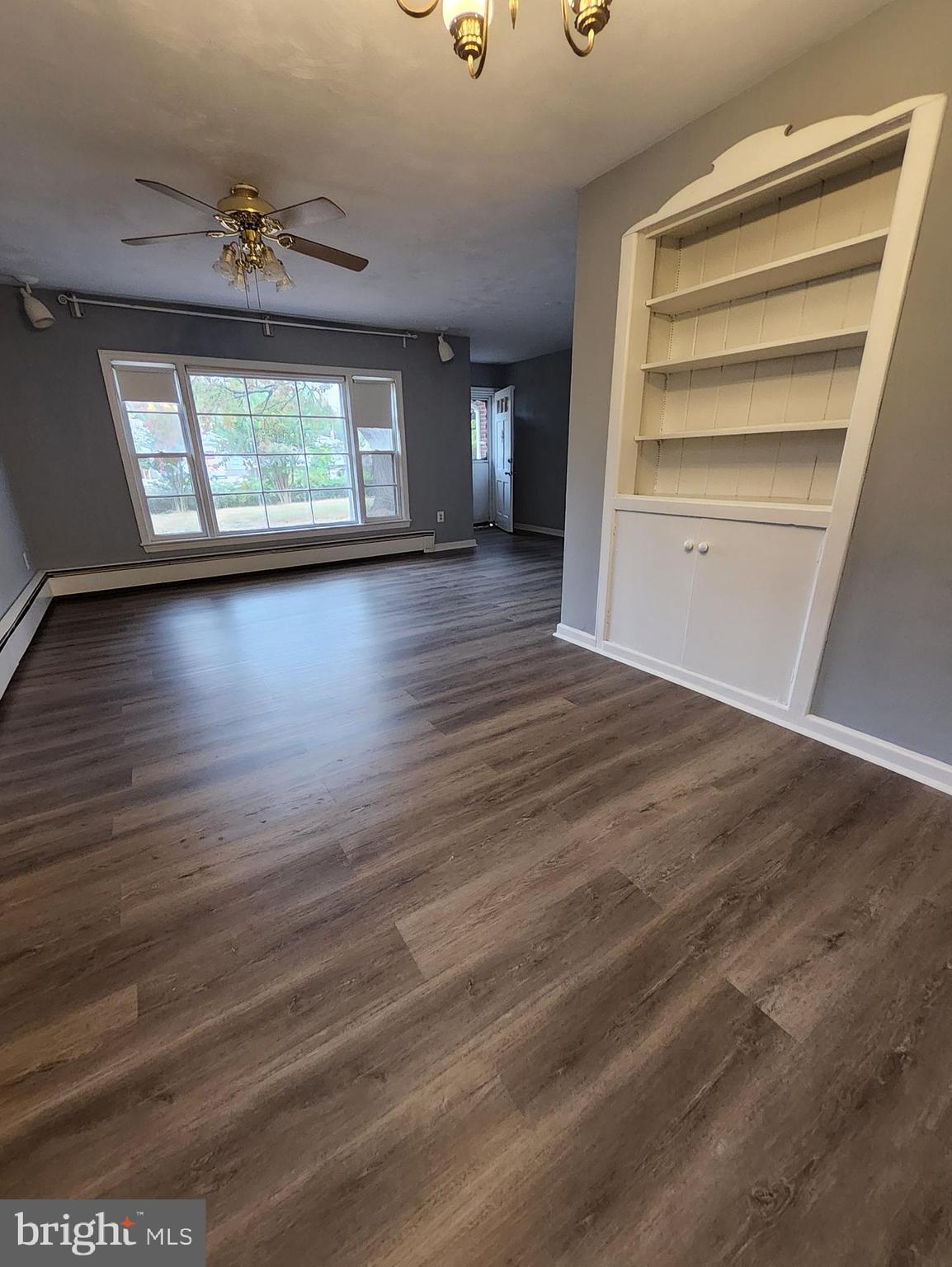 13723 Dumfries Road Manassas, VA 20112 - Photo 6 of 21 wooden floor in an empty room with a window