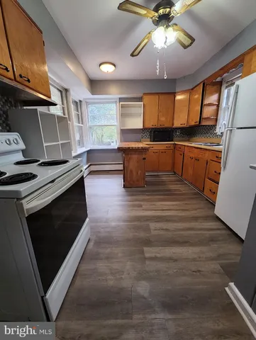 a view of kitchen with microwave and stove