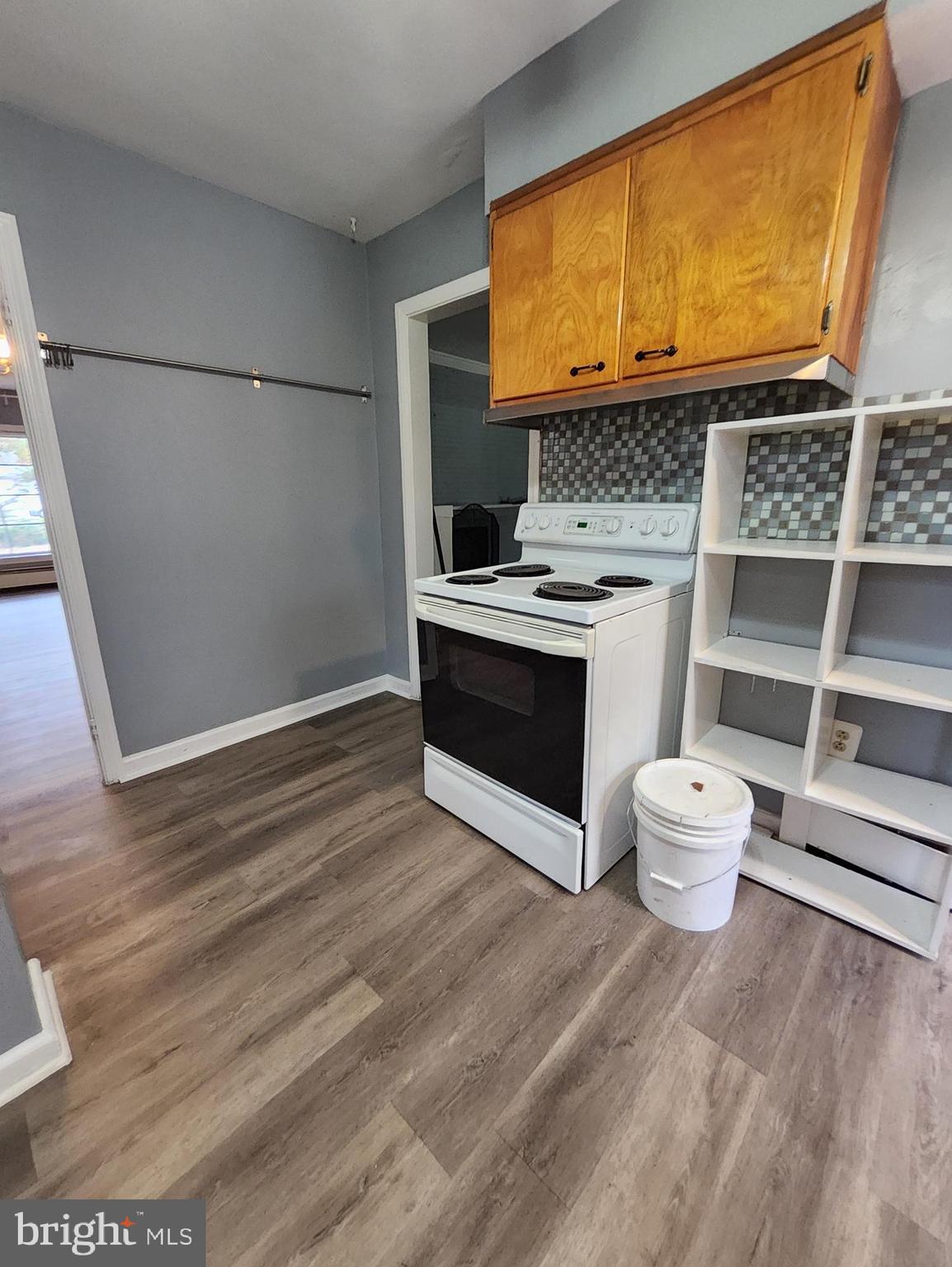 13723 Dumfries Road Manassas, VA 20112 - Photo 10 of 21 a view of a kitchen with wooden floor and electronic appliances