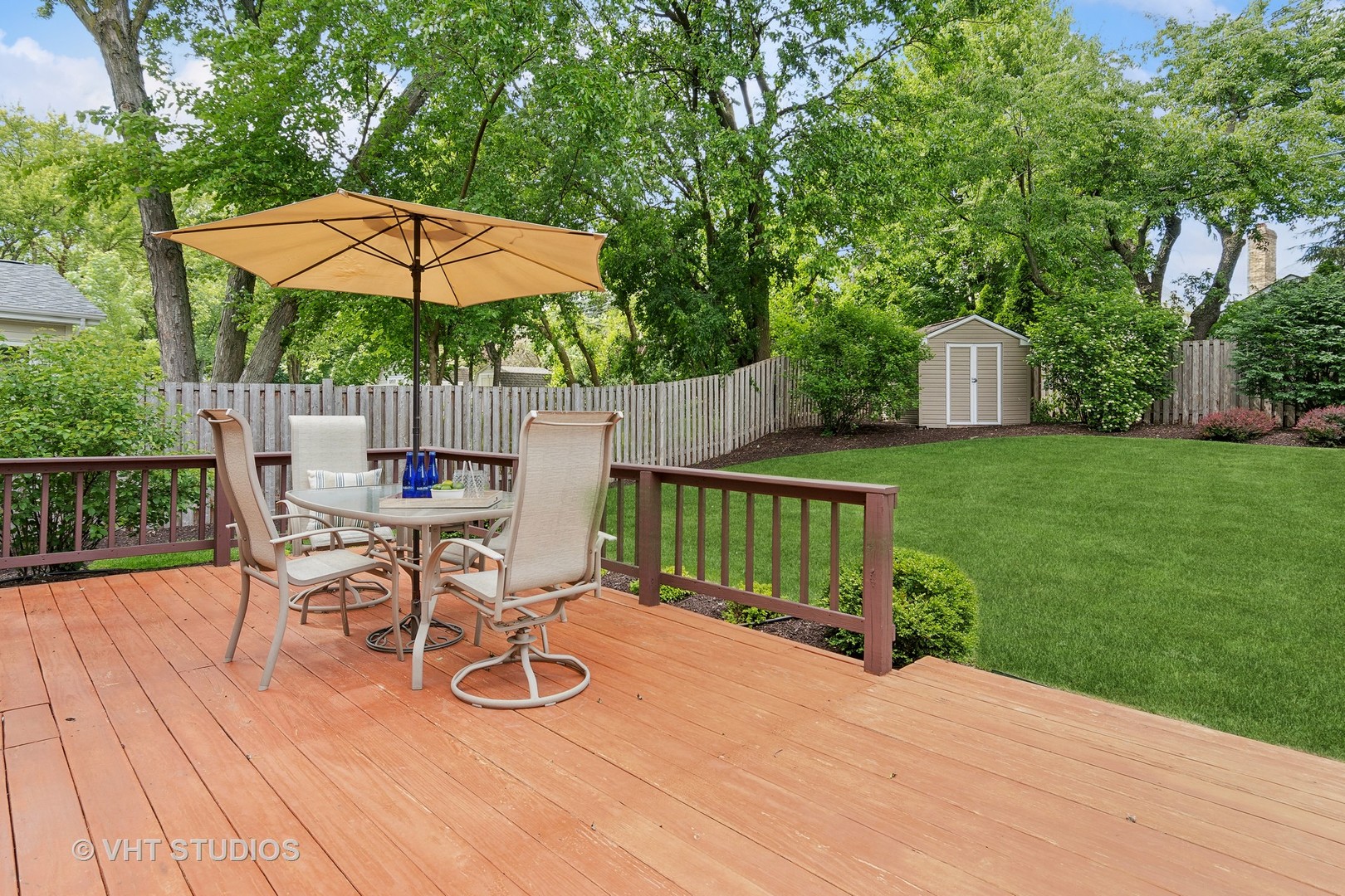 337 Cedarbrook Road Naperville, IL 60565 - Photo 23 of 37 a table and chairs in patio with wooden fence