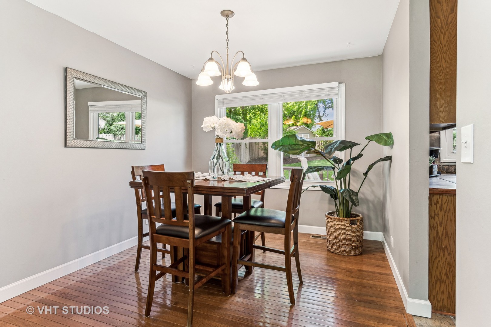 337 Cedarbrook Road Naperville, IL 60565 - Photo 6 of 37 a view of a dining room with furniture window and wooden floor