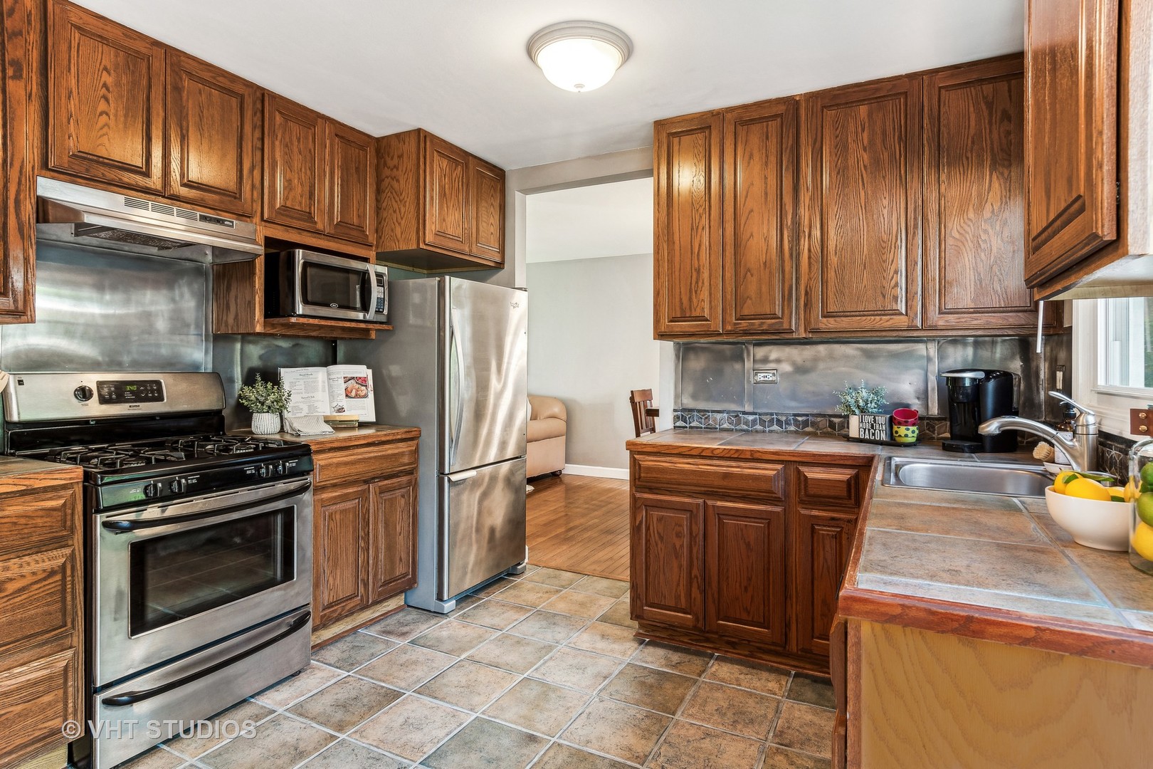 337 Cedarbrook Road Naperville, IL 60565 - Photo 7 of 37 a kitchen with stainless steel appliances granite countertop a stove refrigerator sink and cabinets