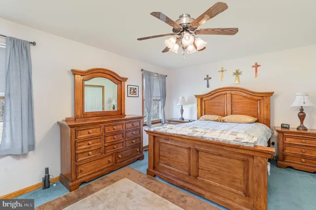 a bedroom with a bed and a dresser