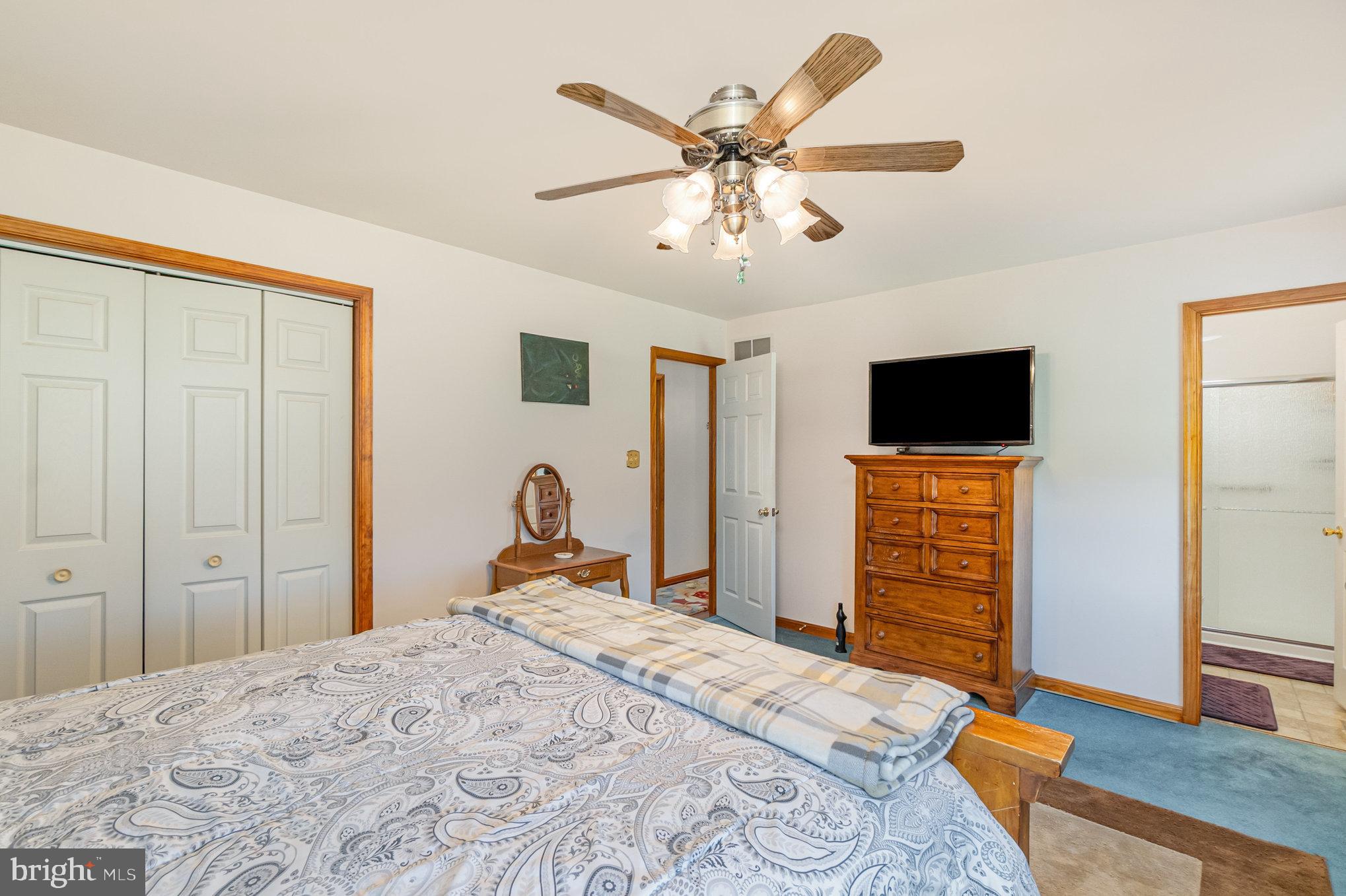 316 Hitching Post Drive Rising Sun, MD 21911 - Photo 15 of 42 a bedroom with a bed and a flat screen tv