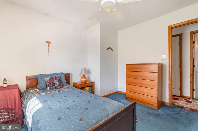 a bedroom with a bed and furniture