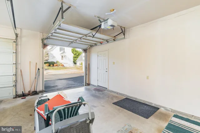 a view of a chair and tables on the roof deck