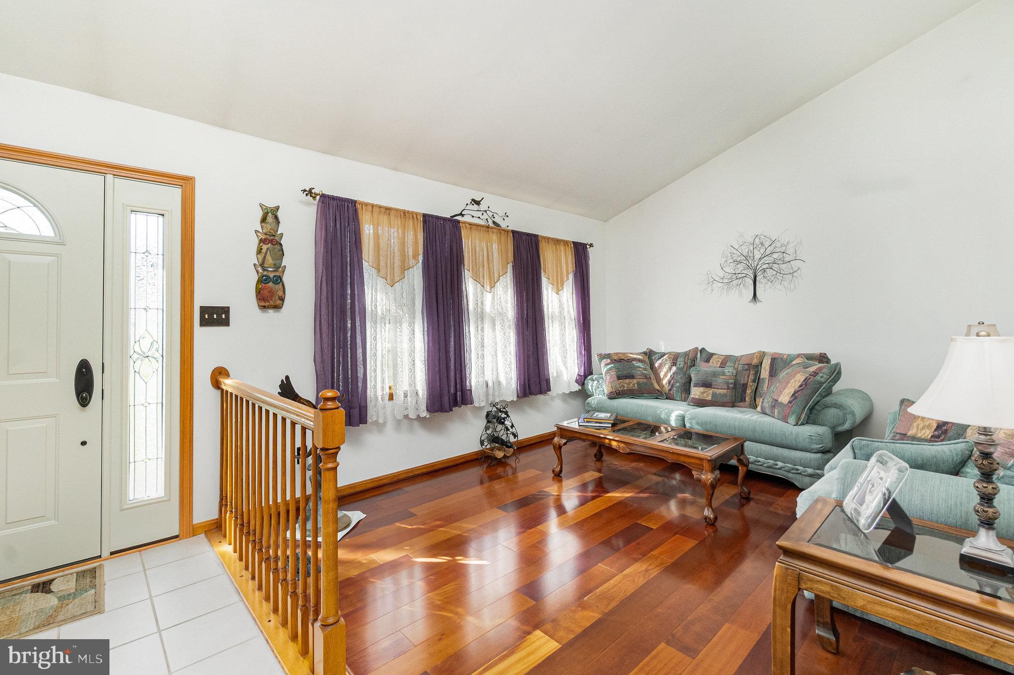 316 Hitching Post Drive Rising Sun, MD 21911 - Photo 7 of 42 a living room with furniture and large windows