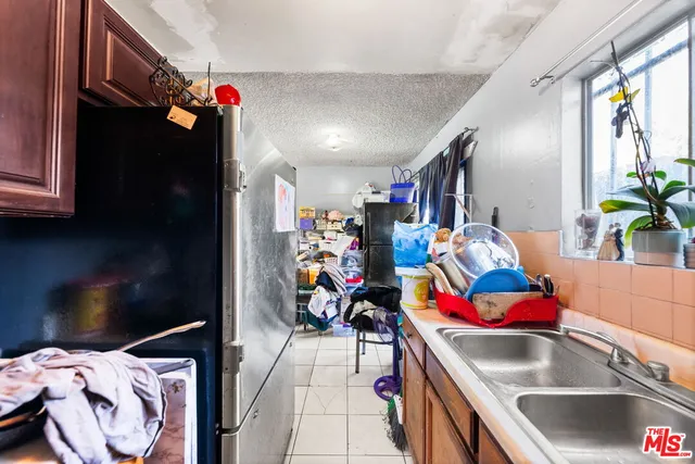 a living room with furniture and stairs