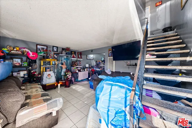 a room with furniture toys and a flat screen tv