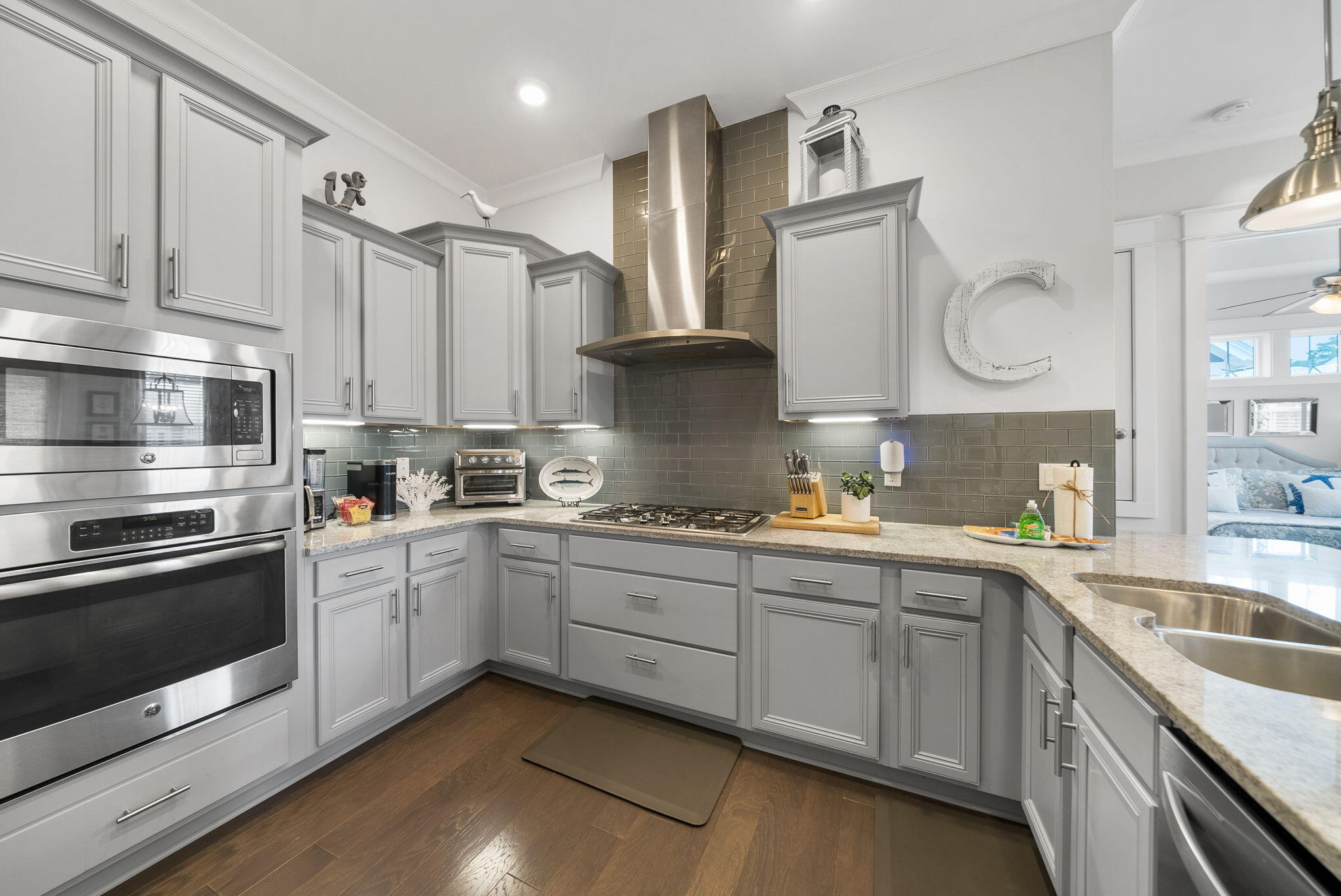 11 East E Pine, Unit C Inlet Beach, FL 32461 - Photo 14 of 40 a kitchen with stainless steel appliances granite countertop a sink and cabinets