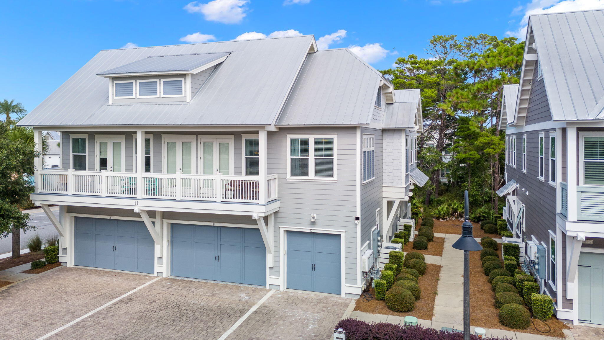 11 East E Pine, Unit C Inlet Beach, FL 32461 - Photo 3 of 40 a front view of a house with a garden