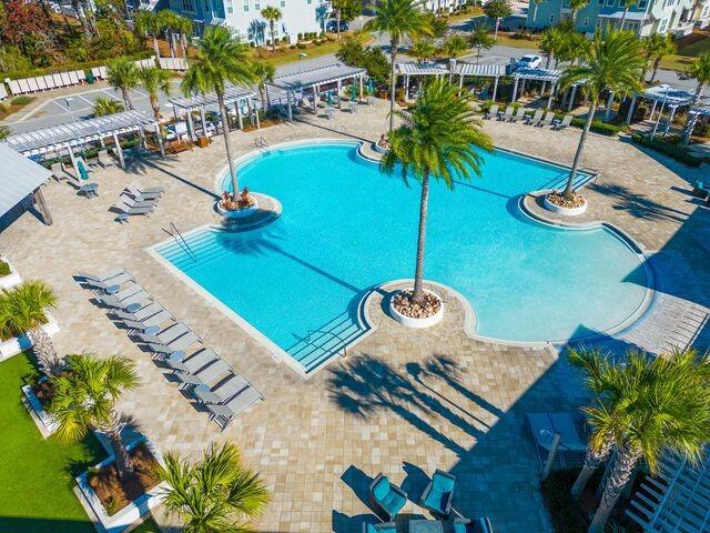 11 East E Pine, Unit C Inlet Beach, FL 32461 - Photo 32 of 40 a view of a swimming pool with chairs and plants