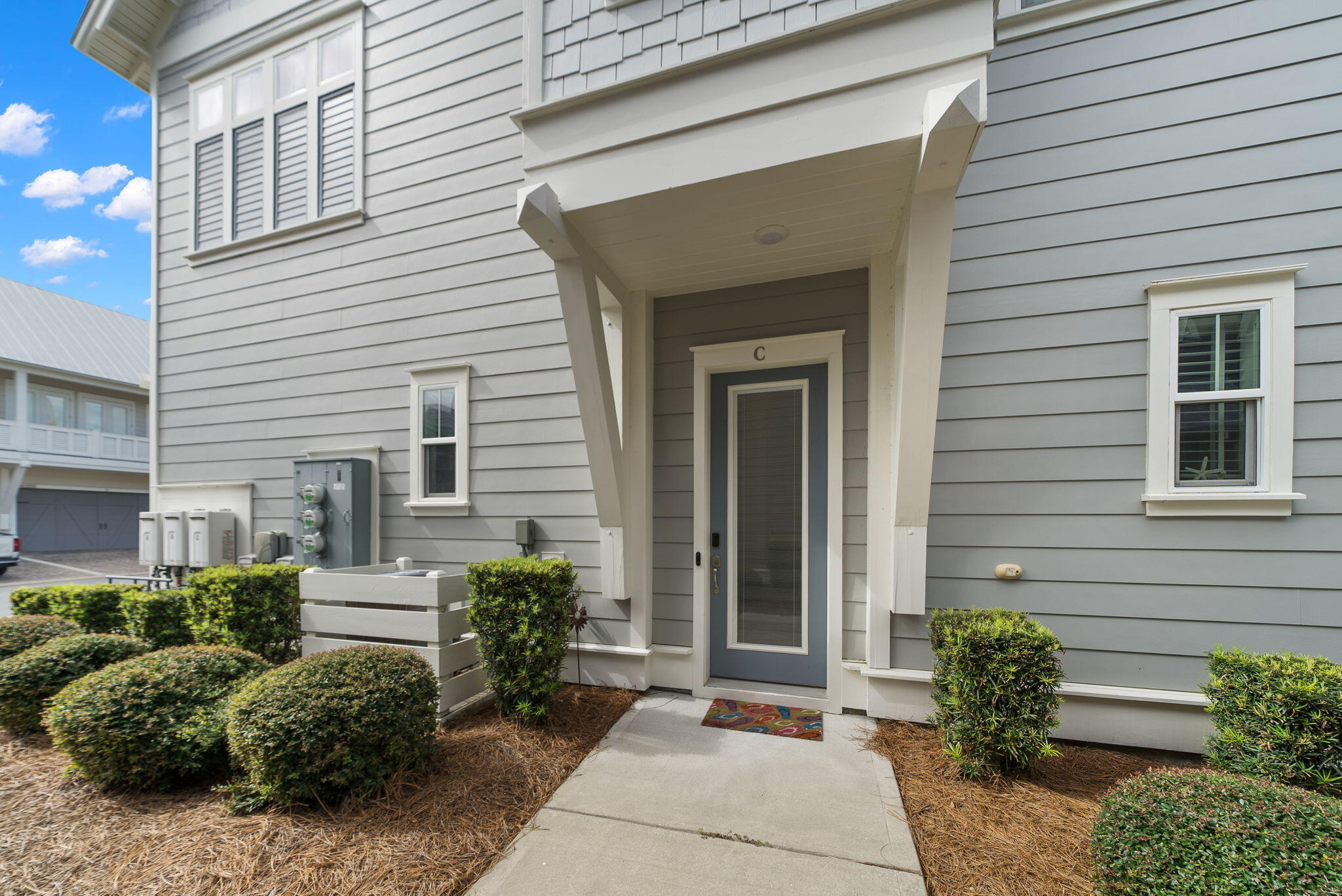 11 East E Pine, Unit C Inlet Beach, FL 32461 - Photo 6 of 40 a front view of a house with potted plants